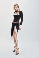 Chocolate brown Moroccan crepe skirt featuring contrasting ecru lace detailing, eyelet accents and a statement belt buckle. Designed with a sophisticated silhouette for effortless day-to-night styling, dinners, special occasions and elevated winter looks.