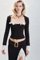 Chocolate brown Moroccan crepe jacket detailed with contrasting ecru delicate lace inserts. Finished with eyelet detailing and a zip fastening, creating a refined statement silhouette. Designed for elevated day-to-night dressing, dinners, special occasions and winter events.