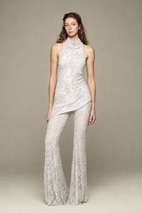 Fully hand-embroidered tulle top in white with all-over sequins and flared legs for a sleek, sparkling look. Designed for your holiday wardrobe and special special events.