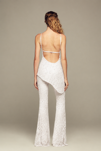 Fully hand-embroidered tulle pants in white with all-over sequins and flared legs for a sleek, sparkling look. Designed for your holiday wardrobe and special special events.