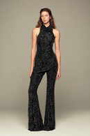 Fully hand-embroidered tulle set in black with all-over sequins and flared legs for a sleek, sparkling look. Designed for your holiday wardrobe and special special events.