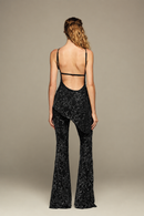 Fully hand-embroidered tulle set in black with all-over sequins and flared legs for a sleek, sparkling look. Designed for your holiday wardrobe and special special events.