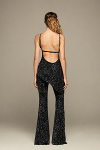 Fully hand-embroidered tulle set in black with all-over sequins and flared legs for a sleek, sparkling look. Designed for your holiday wardrobe and special special events.