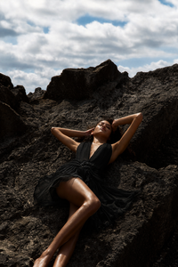 Black halter neck silk dress with ruffled details and custom handmade embroidery for summer events and special occasions