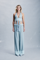 Crepe double-face top featuring contrast detailing at the waist, an appliqué tie detail and all-over crystal embellishment. A sophisticated statement top designed for eveningwear, celebrations, parties and elevated winter occasions.