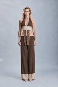 Crepe double-face trousers with contrast detailing and crystal embellishment tracing the front stitching. Featuring a refined tailored silhouette, these statement trousers are designed for evening outfits, parties, celebrations and sophisticated winter dressing.