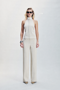 Beige cotton-gabardine top featuring contrasting white cotton pipping detail and a distinctive strip hook fastening. Designed with a refined structured finish for everyday dressing, modern layering, elevated casual looks and sophisticated winter styling.