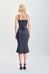 Gray corset woven with subtle yellow stripes and crafted from a soft viscose-blend fabric. Finished with refined eyelet detailing and a structured fitted silhouette. Designed for sophisticated eveningwear, layering, special occasions and statement winter dressing.