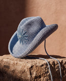 Hand-crocheted baby blue cotton sun hat with beaded sunburst embroidery and an oversized brim, the perfect luxury accessory for summer holidays and beach vacations.