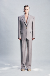 Taupe wool-blend trousers featuring cupro pocket lining detail and a refined tailored silhouette. Finished with classic button and zip fastening, these sophisticated trousers are designed for everyday dressing, coordinated tailoring, workwear and elevated winter outfits.
