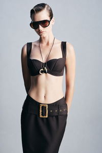 Chocolate brown bra crafted from luxurious 100% wool with delicate hook detailing and a refined structured finish. Designed as a statement layering piece for evening styling, sophisticated outfits, special occasions and elevated winter dressing.
