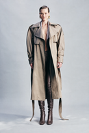Beige neutral green trench coat crafted from a cotton-blend fabric with contrasting cupro detailing and refined hardware. Finished with classic button fastening, this timeless trench is designed for elevated everyday dressing, city styling and transitional cold-weather layering.